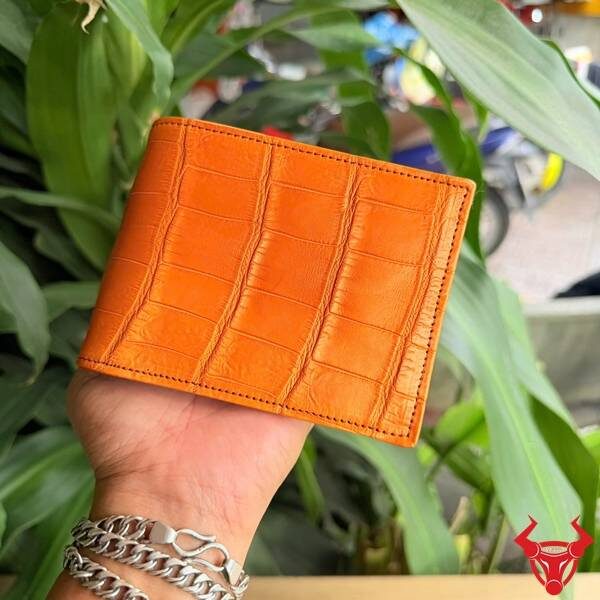 Ví ngang da bụng cá sấu Thái Lan màu cam ấn tượng.